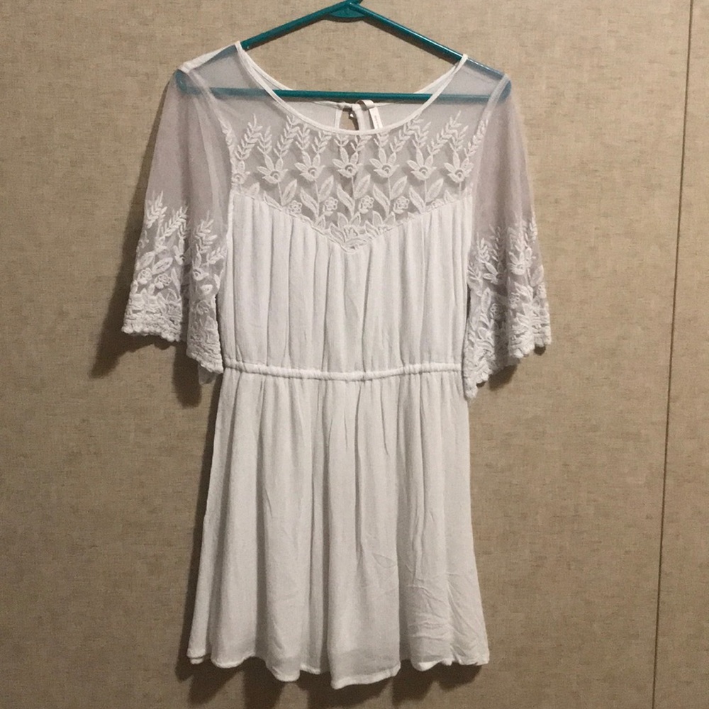 White thigh length dress